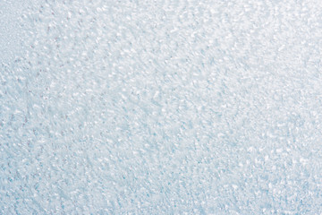 Frozen winter abstract background on the window glass with copy space