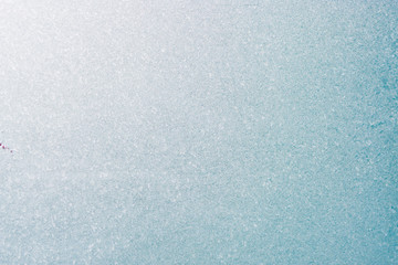 Frozen winter abstract background on the window glass with copy space