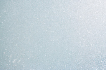 Frozen winter abstract background on the window glass with copy space