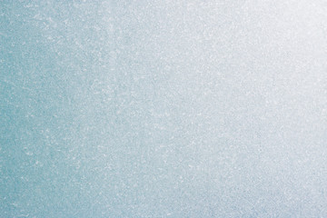 Frozen winter abstract background on the window glass with copy space