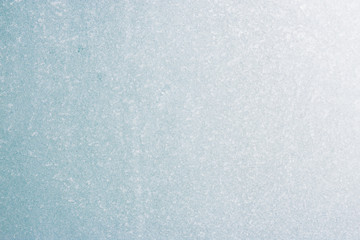 Frozen winter abstract background on the window glass with copy space