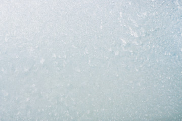 Frozen winter abstract background on the window glass with copy space