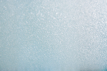 Frozen winter abstract background on the window glass with copy space