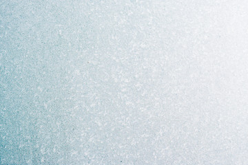 Frozen winter abstract background on the window glass with copy space