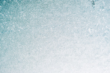 Frozen winter abstract background on the window glass with copy space