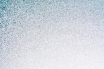Frozen winter abstract background on the window glass with copy space