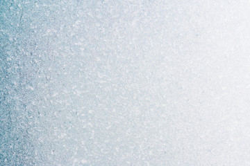 Frozen winter abstract background on the window glass with copy space