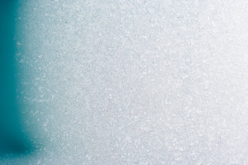 Frozen winter abstract background on the window glass with copy space