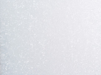 Frozen winter abstract background on the window glass with copy space