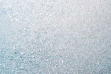 Frozen winter abstract background on the window glass with copy space