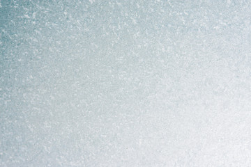 Frozen winter abstract background on the window glass with copy space