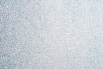 Frozen winter abstract background on the window glass with copy space