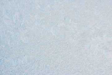 Winter background with gleaming ice. Frozen water texture. Copy space