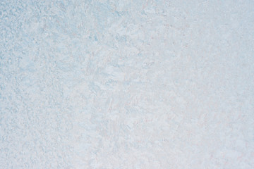 Winter background with gleaming ice. Frozen water texture. Copy space