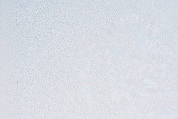 Winter background with gleaming ice. Frozen water texture. Copy space