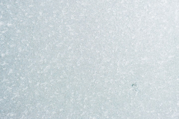 Winter background with gleaming ice. Frozen water texture. Copy space
