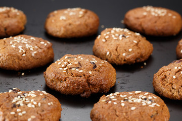 Homemade oatmeal cookies on a baking sheet. Selective focus.