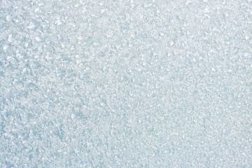Ice background, frozen water with glass. Winter texture. Copy space.