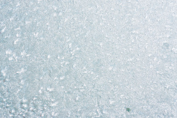 Frozen winter abstract background on the window glass with copy space