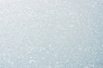 Frozen winter abstract background on the window glass with copy space
