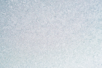 Frozen winter abstract background on the window glass with copy space