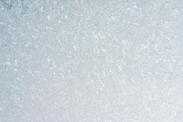 Frozen winter abstract background on the window glass with copy space