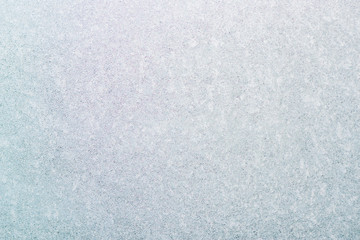 Frozen winter abstract background on the window glass with copy space