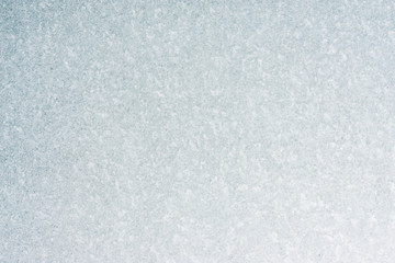 Frozen winter abstract background on the window glass with copy space