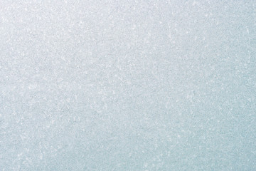 Frozen winter abstract background on the window glass with copy space