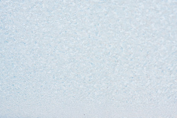Fototapeta premium Frozen winter abstract background on the window glass with copy space