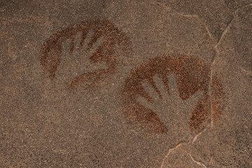 the image of hands on the wall of the cave, painted by ancient man. archaeology.