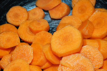 Carrot cleaned and cut into slices for cooking.
