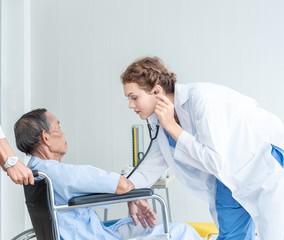 Obraz premium Senior man and doctor helping hands ,explaining diagnosis to his male patient in medical office at hospital/ clinic .Elderly care medicine, age, health care, cardiology and people concept