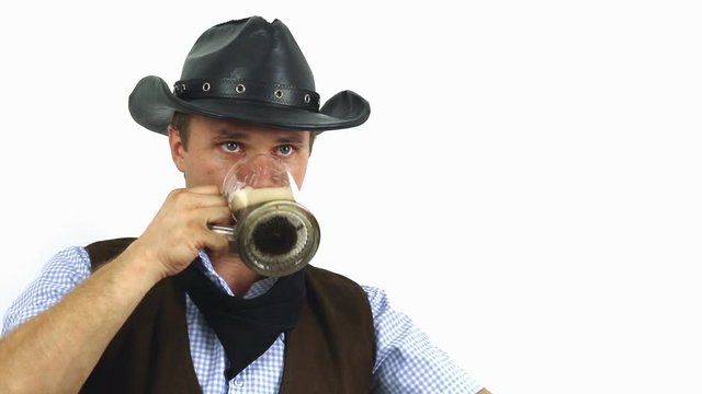 Cowboy in hat drinking beer on a white background