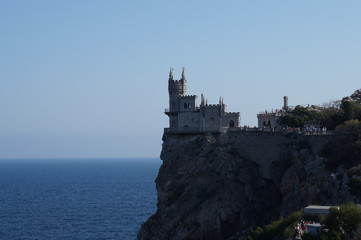 Fototapeta na wymiar Small castle on the background of the sea