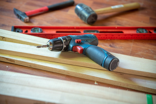 Different construction tools with Hand tools for home renovation on wooden board maintenance and reparing concept.