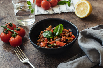 Vegetable Stew with Beans, Mushrooms and Tomatoes on a wooden background