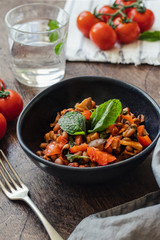 Vegetable Stew with Beans, Mushrooms and Tomatoes on a wooden background