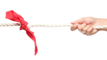 Hands holding rope and pulling. (Tug of war)