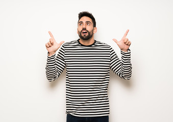 Fototapeta premium handsome man with striped shirt pointing with the index finger a great idea