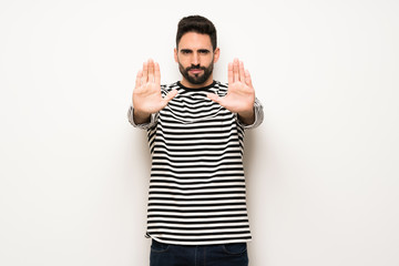 Naklejka premium handsome man with striped shirt making stop gesture for disappointed with an opinion
