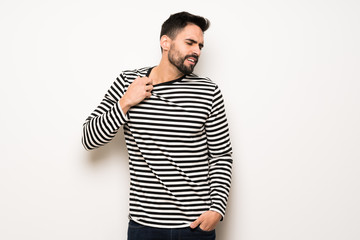 handsome man with striped shirt with tired and sick expression