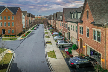 Aerial view of typical East Coast USA newly constructed suburban luxury townhouse community real estate in Maryland with brick facade the American Dream