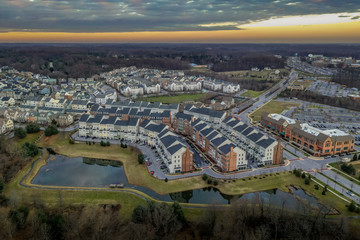 Fototapeta na wymiar Aerial view of typical East Coast USA newly constructed suburban luxury townhouse community real estate in Maryland with brick facade the American Dream