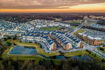 Aerial view of typical East Coast USA newly constructed suburban luxury townhouse community real estate in Maryland with brick facade the American Dream