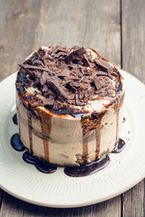 Fresh chocolate cake on the dark rustic background. Selective focus.