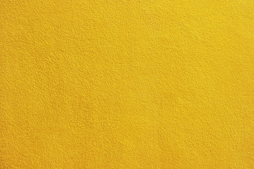 Gold paint cement wall background for design.