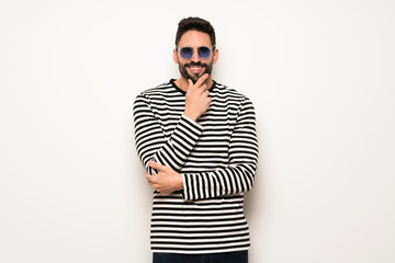 handsome man with striped shirt with glasses and smiling