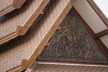 Thai wood carving pattern roof background.