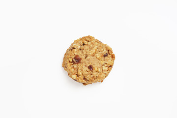 oatmeal cookie or oat biscuit with raisins and nuts - top view on white background